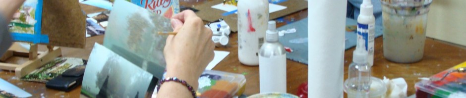 students doing mini landscape paintings in acrylic